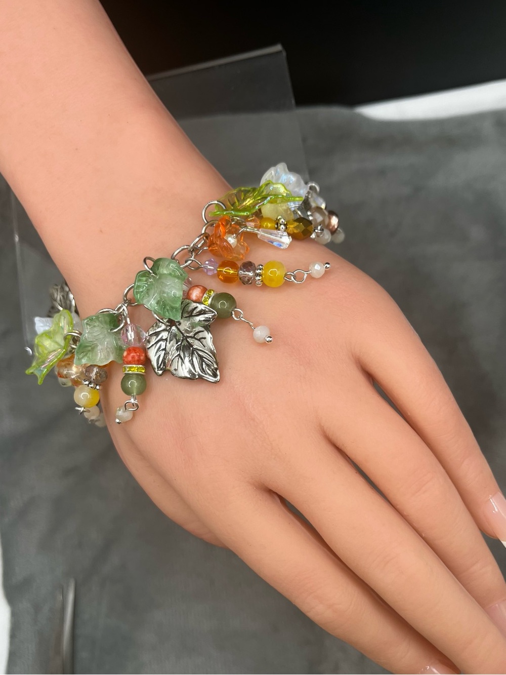 Beaded Leaf Charm Bracelet in Glass & few Acrylic Green Amber silver tone 7 1/8”